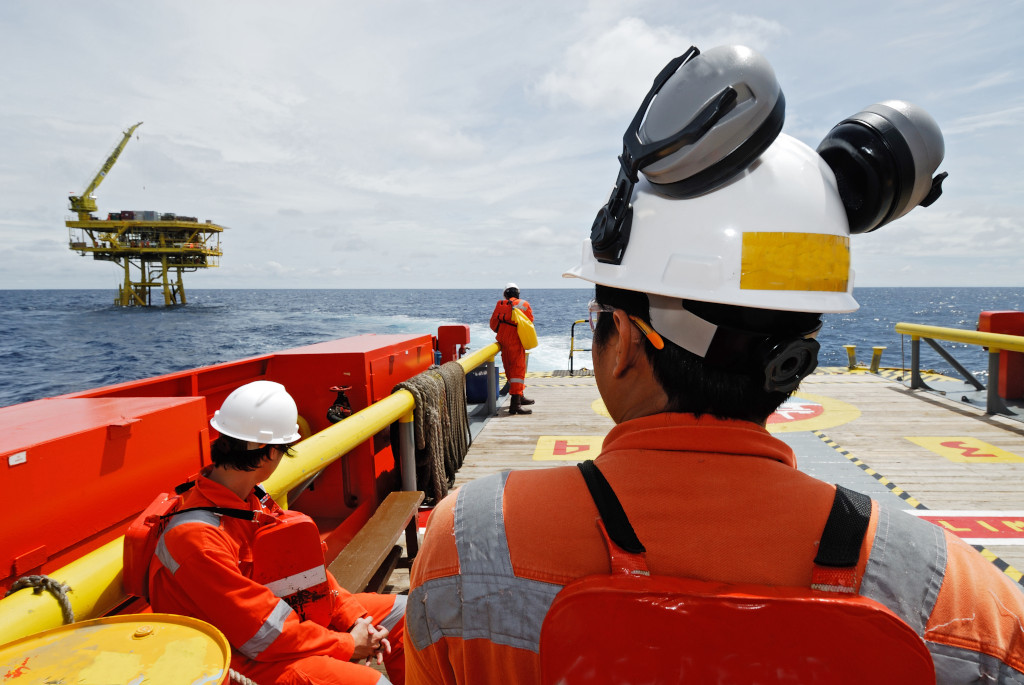 Workers,on,transport,boat,to,offshore,rig.,industrial.,energy.,power